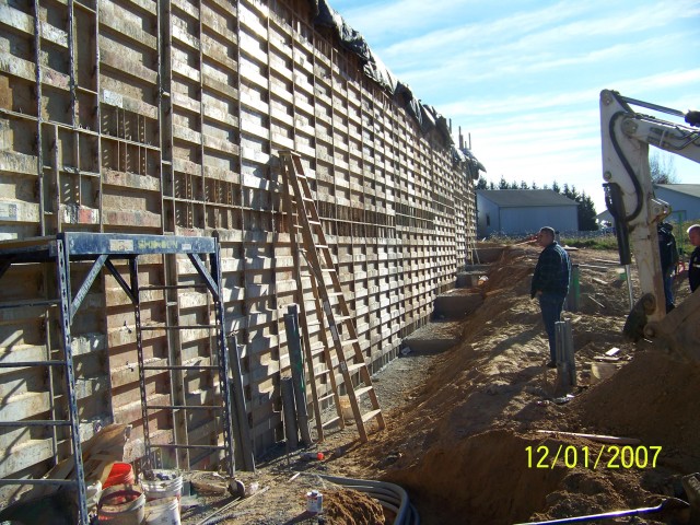 Gary Unverzagt inspecting retaining wall for east apron.